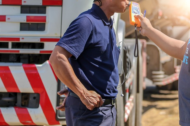 man doing a breathalyzer test