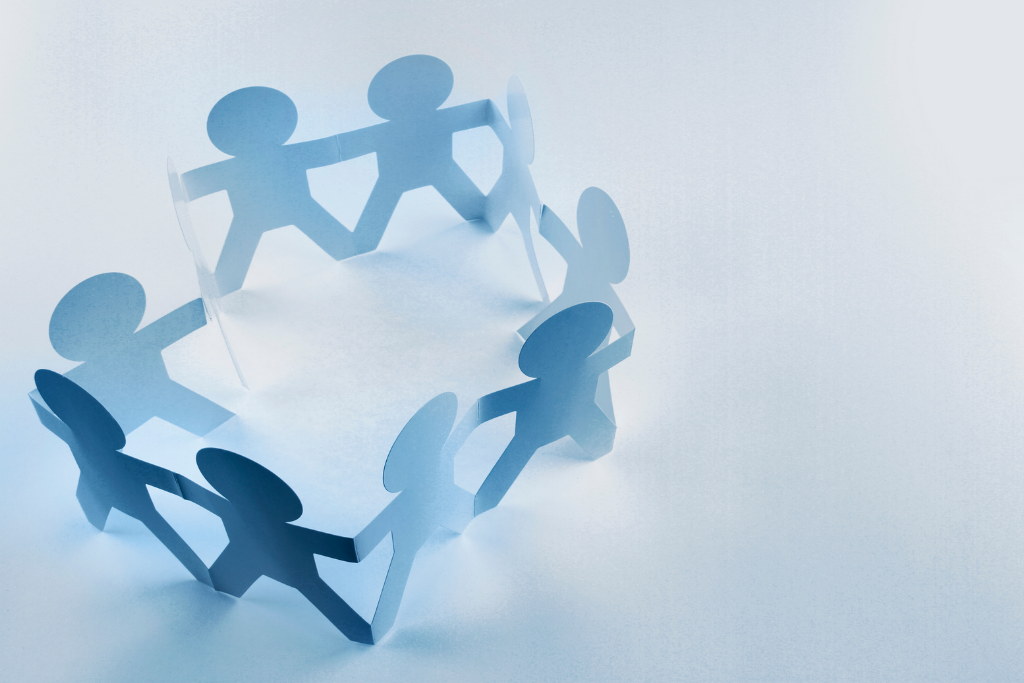 Supervisor in Meridian reviewing opioid education materials with warehouse staff during a safety meeting.